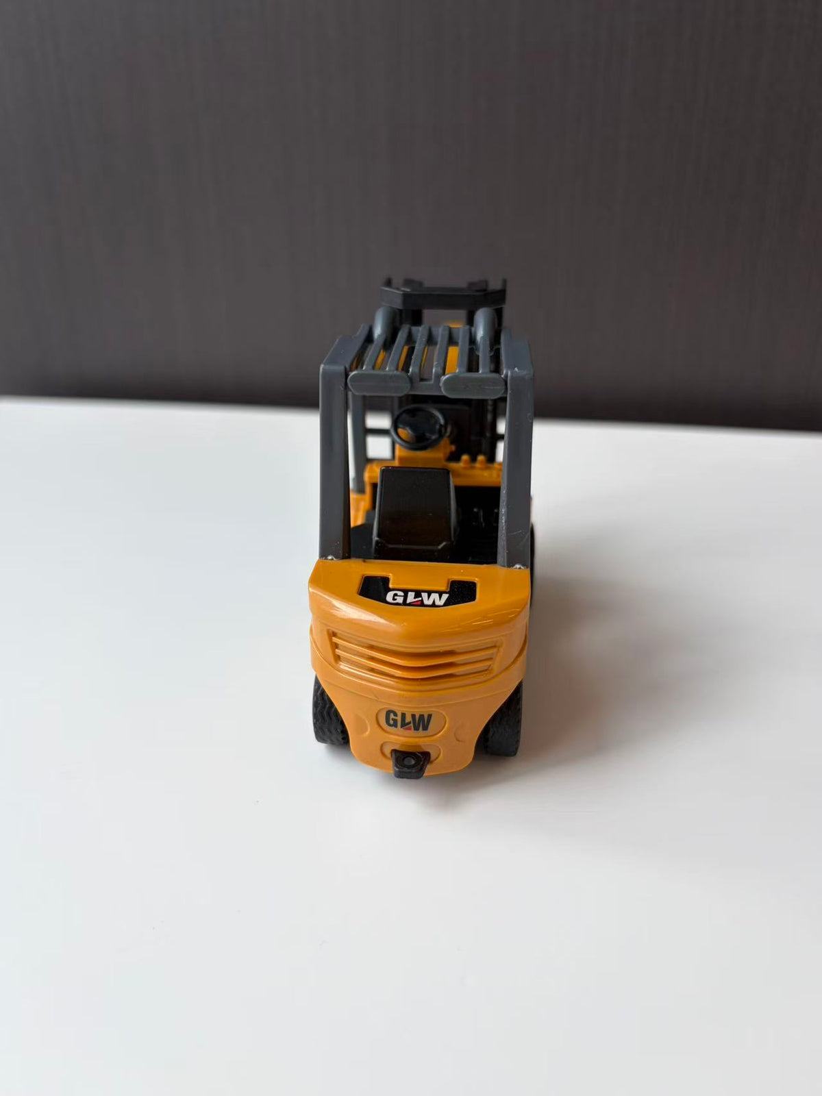 Yellow Industrial Forklift Model with Raised Mast and Forks