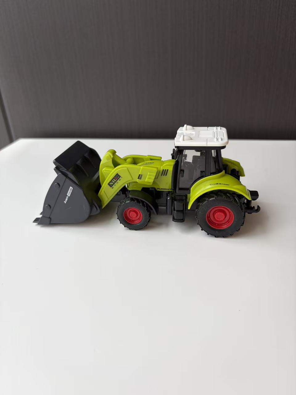 Green Compact Front Loader Model with Black Utility Bucket