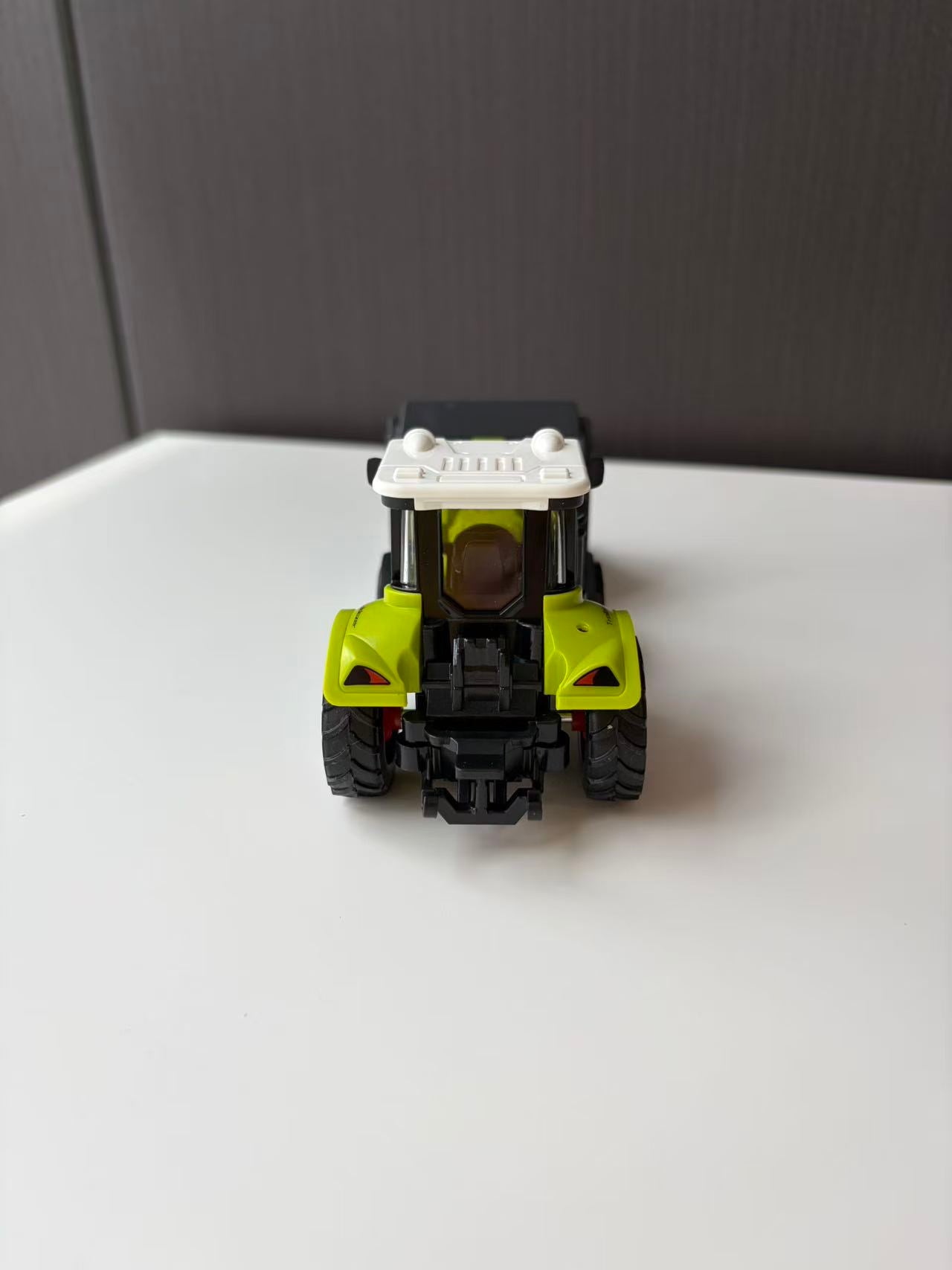 Green Compact Front Loader Model with Black Utility Bucket