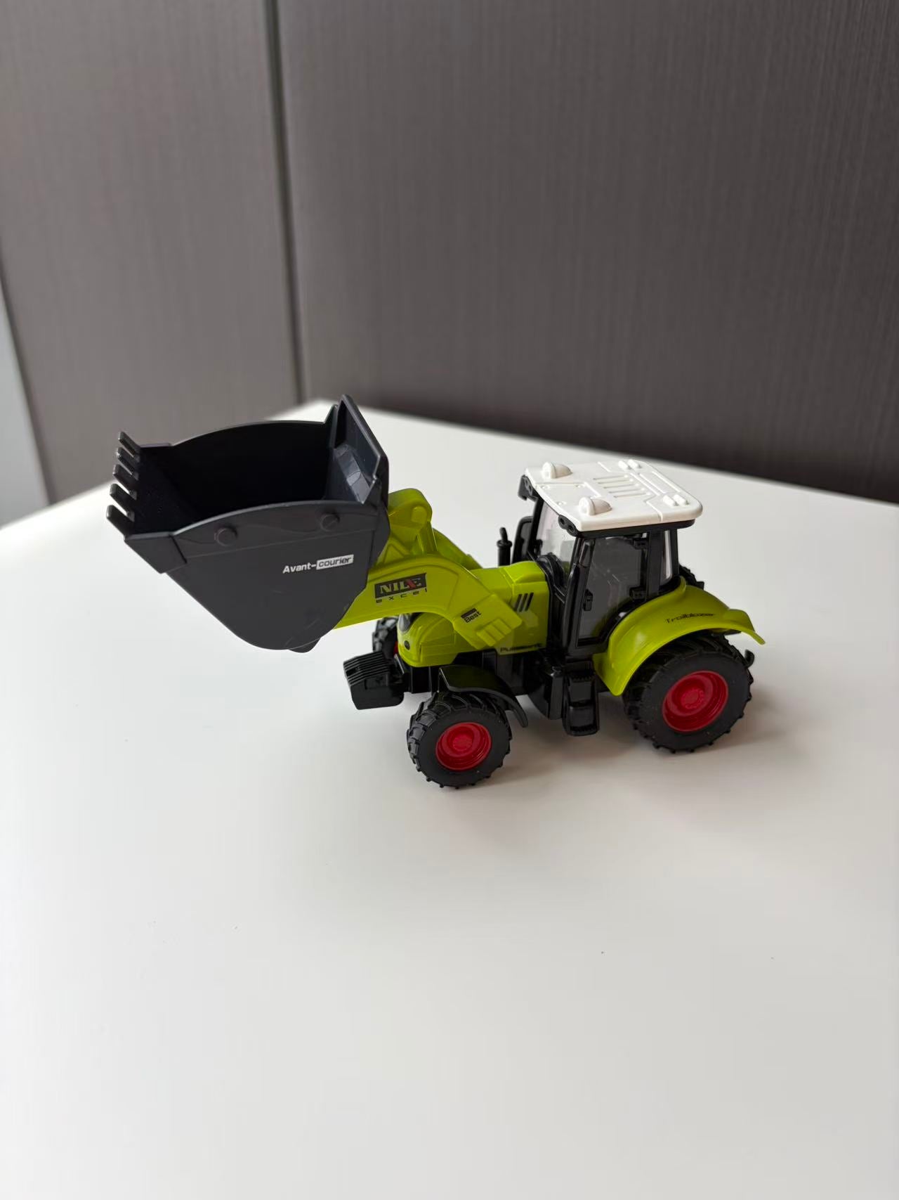 Green Compact Front Loader Model with Black Utility Bucket
