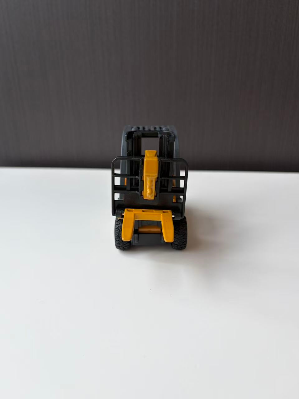 Yellow Industrial Forklift Model with Raised Mast and Forks