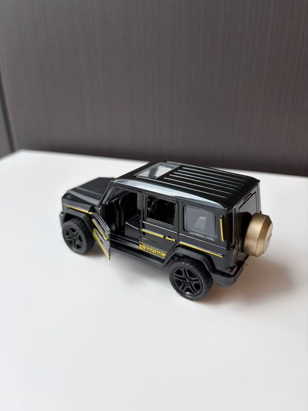 Black Off-Road SUV Model with Roof Rack and Spare Wheel