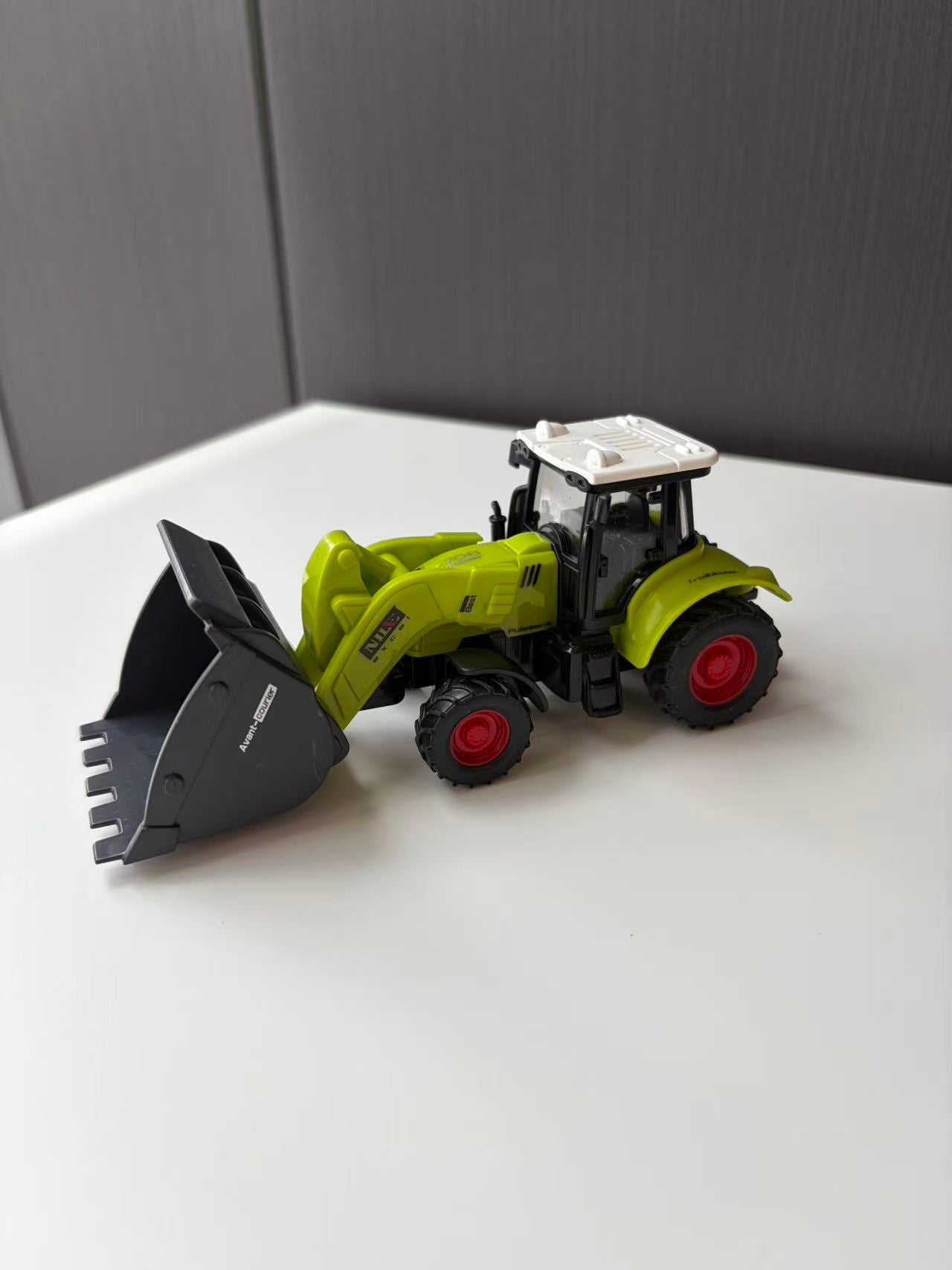 Green Compact Front Loader Model with Black Utility Bucket